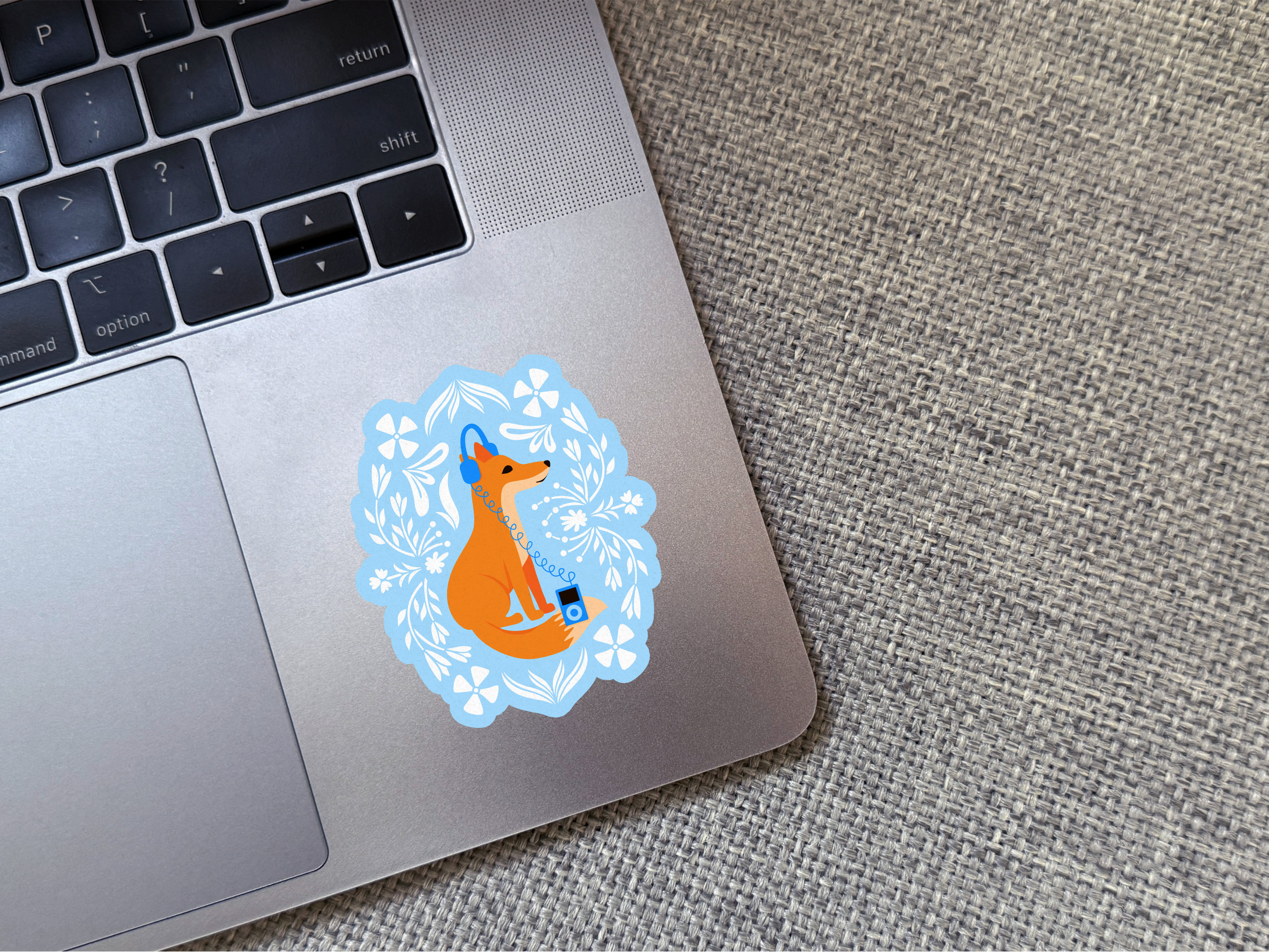 Floral fox sticker on laptop